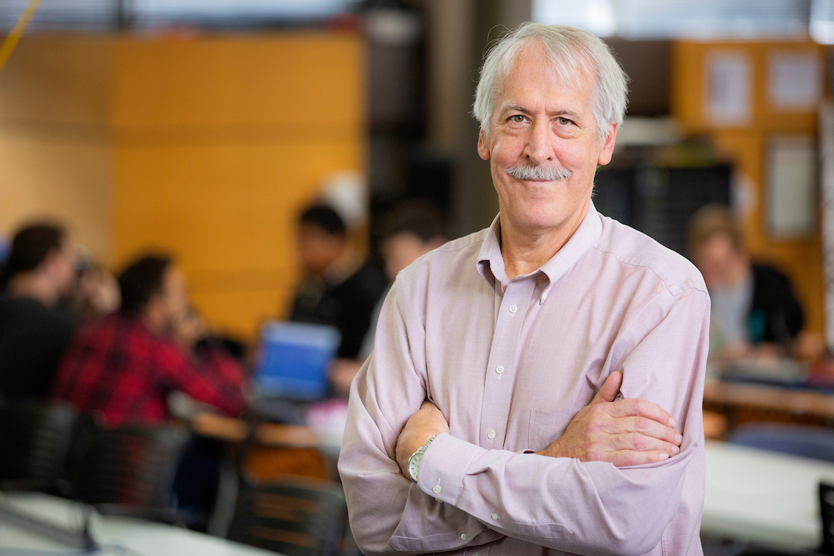 Doug Jacobson standing in the transformative learning area inside Coover.